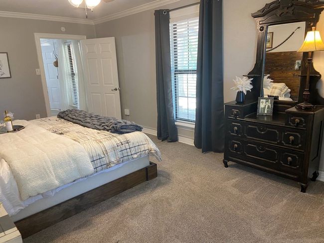 Carpeted bedroom with ornamental molding | Image 13