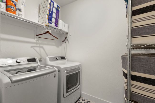 Washroom with separate washer and dryer and baseboards | Image 26