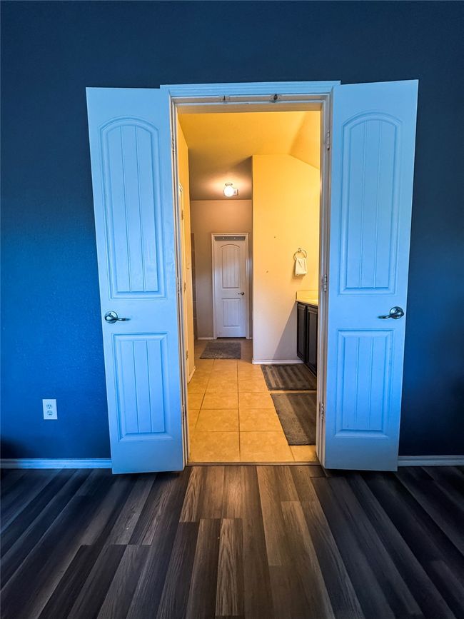 Corridor with dark wood-style flooring and baseboards | Image 21