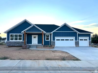 Craftsman inspired home featuring covered porch and a garage | Image 1