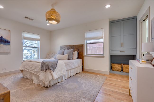 Bedroom with light wood-style flooring, recessed lighting, visible vents, and baseboards | Image 11