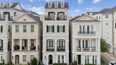 This 4 story home satisfies with two spacious baconies with treelined lake views! | Image 3