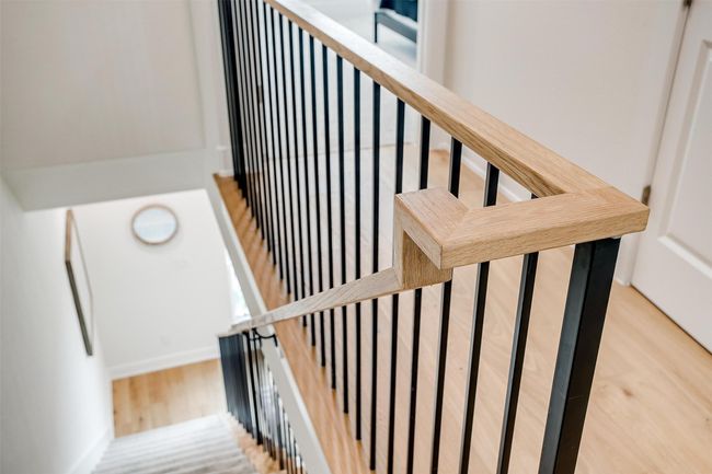 Stairway featuring baseboards and wood finished floors | Image 23