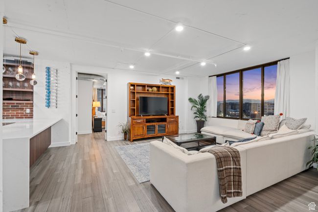 Living room featuring track lighting and LVP flooring | Image 5