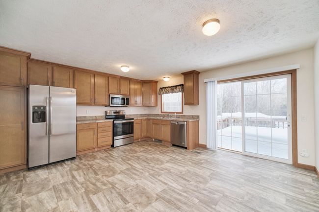Sliding glass doors lead to back deck | Image 9