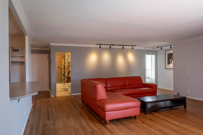 Gleaming hardwood floors throughout living areas | Image 17