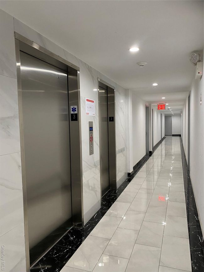 Corridor featuring elevator, recessed lighting, and tile patterned floors | Image 5