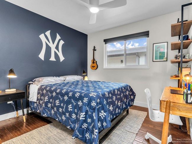 Spacious 3rd Bedroom on the upper floor with with new ceiling fan/light, new window, baseboards and closet system with new doors and new bedroom door. | Image 30