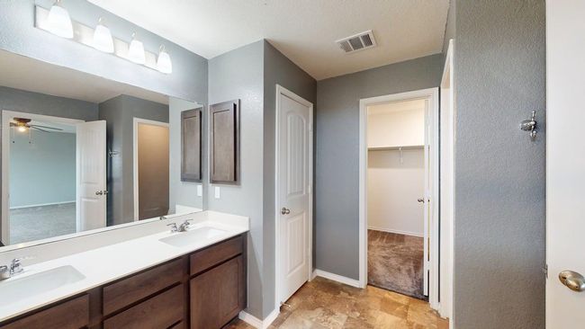 Bathroom with visible vents, a sink, ceiling fan, and double vanity | Image 26