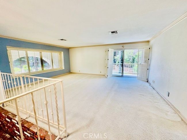 Living room has two windows & slider | Image 15