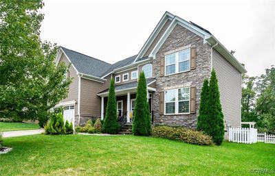 Craftsman-style home with a front yard | Image 2