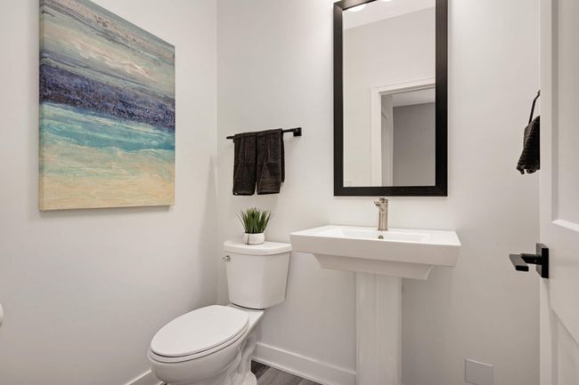 Main level 1/2 bathroom with pedestal vanity | Image 17