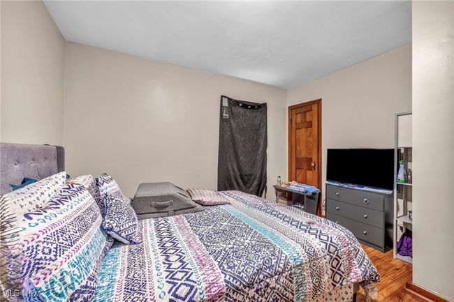 Bedroom featuring wood finished floors | Image 16