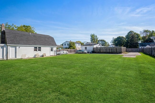 View of yard with a fenced backyard | Image 17
