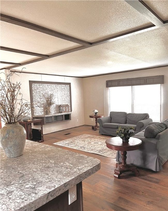 Living area from kitchen view. | Image 7