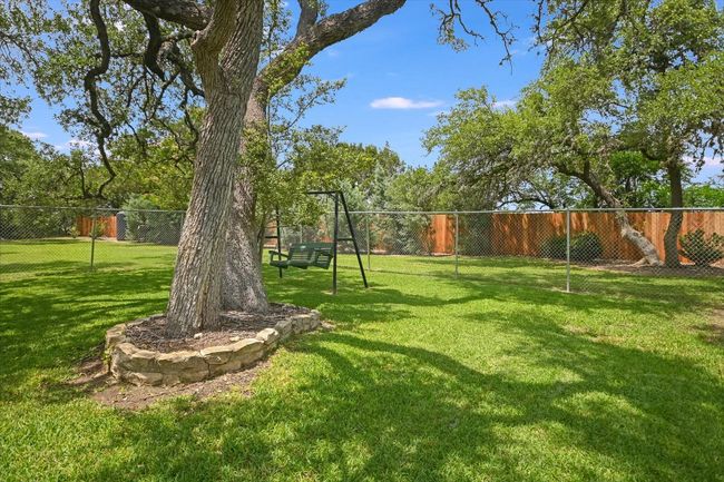 Beautiful shaded back yard. Plenty of room for a pool and garden. | Image 31