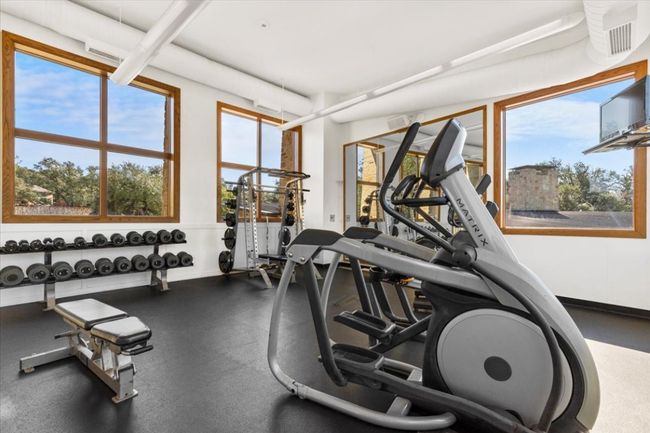 Workout area with baseboards | Image 32
