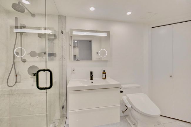 Full bath featuring recessed lighting, toilet, vanity, and a marble finish shower | Image 20