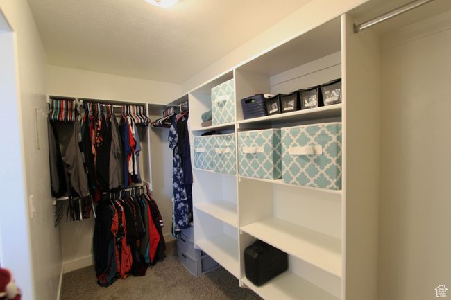 Spacious closet featuring carpet flooring | Image 14
