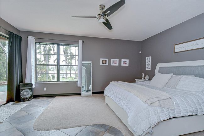 Owner is treated with lanai access and tranquil lake views. | Image 16
