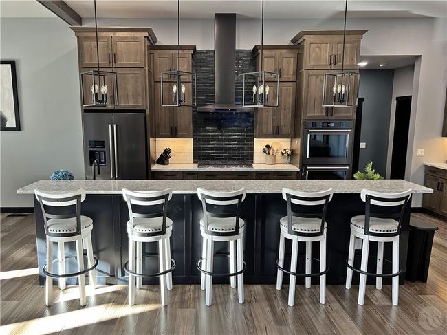 12-foot, 2-tier island with bar sink, tons of storage, and a built-in mixer lift. | Image 9