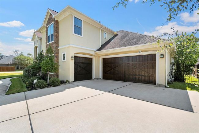 three-car garage, with room for a golf cart as well. | Image 15