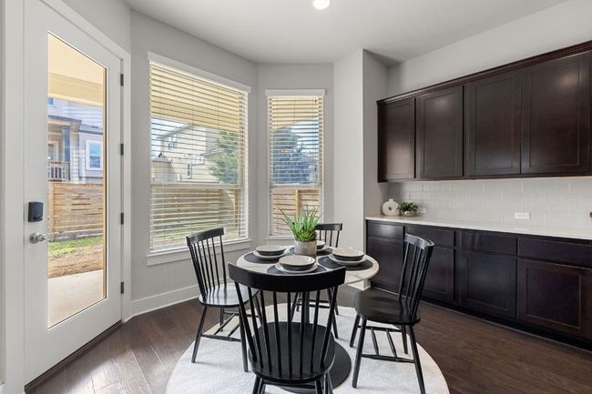 Sunny breakfast room at the end of the kitchen. Look at the number of cabinets. | Image 13