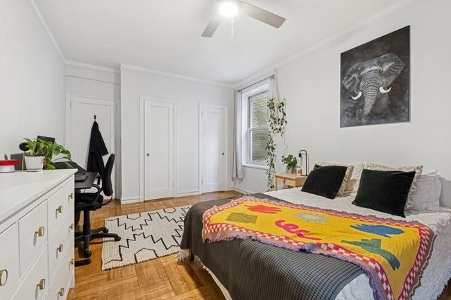 Bedroom featuring crown molding and a ceiling fan | Image 13