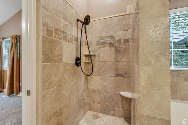 Bathroom with a healthy amount of sunlight and tiled shower | Image 12