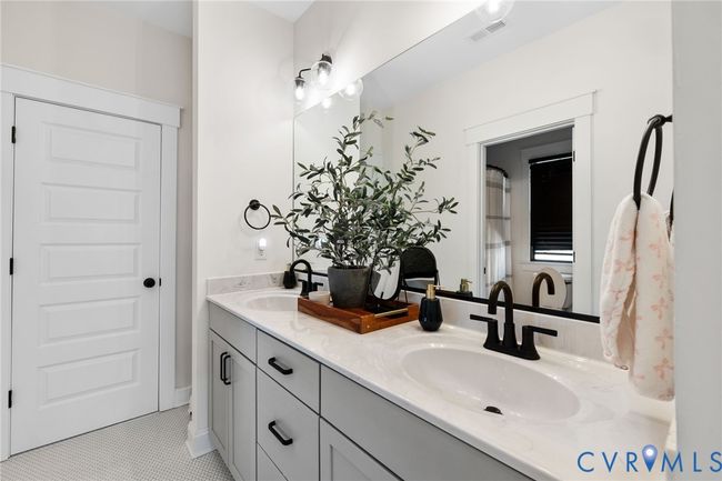Bathroom featuring double vanity and tile patterned floors | Image 30