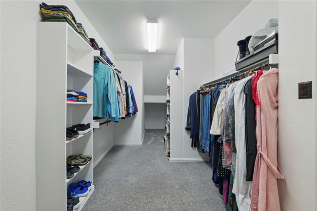 Walk in closet featuring carpet floors | Image 25