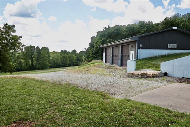 View of outdoor structure featuring a wooded view | Image 14