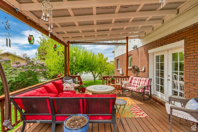 Deck with an outdoor hangout area and french doors | Image 6
