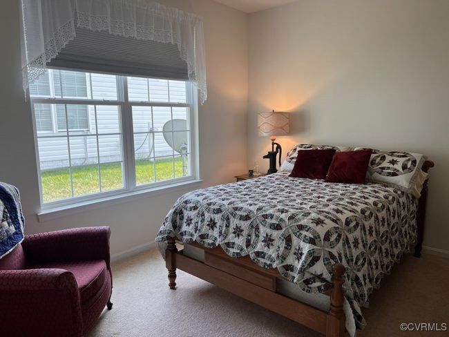 Bedroom with light carpet | Image 38