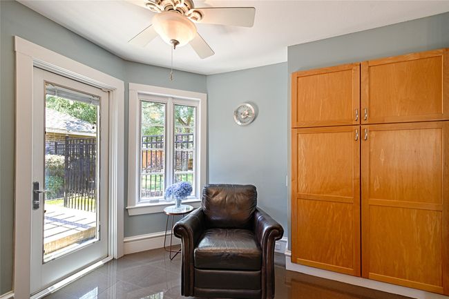 Eat-in portion of kitchen, currently used as reading nook. | Image 23