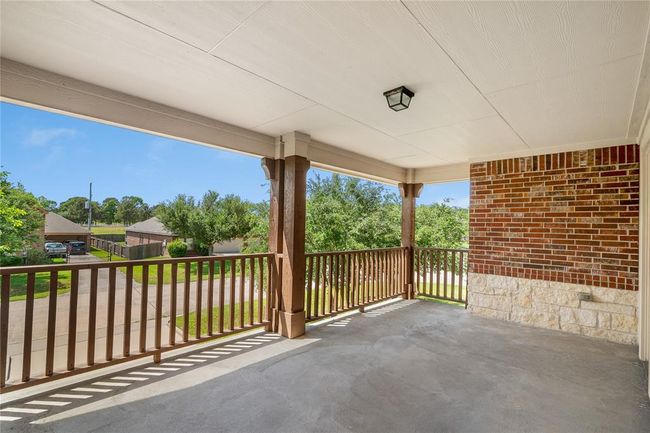Panoramic views of the peaceful neighborhood from this remarkable front balcony. | Image 28
