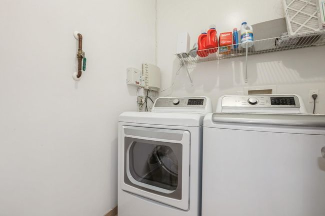Washroom featuring washer and dryer and laundry area | Image 14