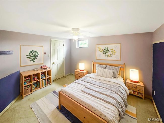 Bedroom with light colored carpet and a ceiling fan | Image 16