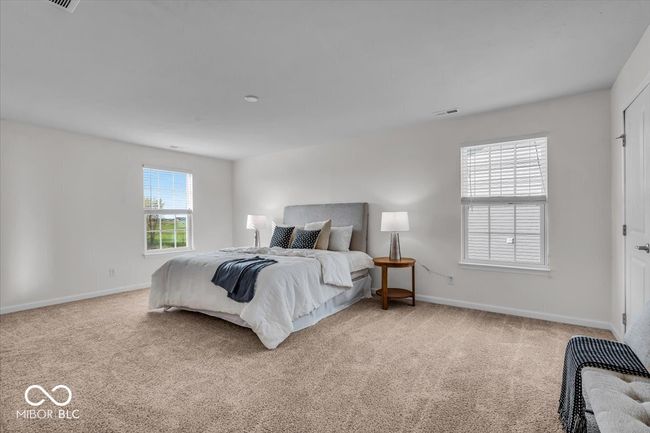 Relax in your primary bedroom suite with plenty of room to stretch out. | Image 15