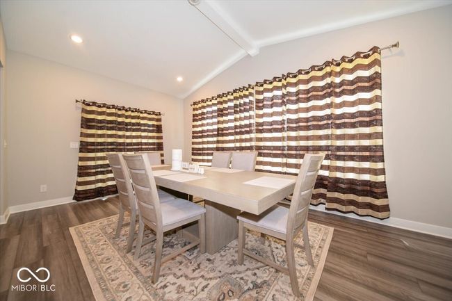 dining space with wood finished floors and recessed lighting | Image 11