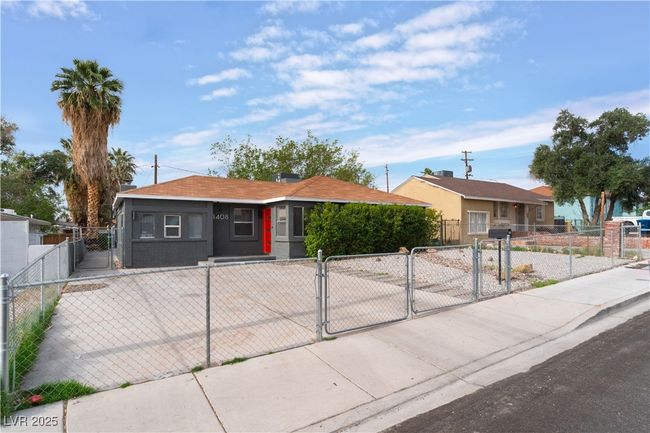 View of front of house with a gate and a fenced front yard | Image 7