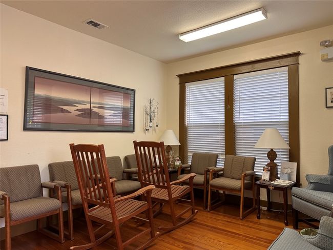 Living area with wood finished floors | Image 7