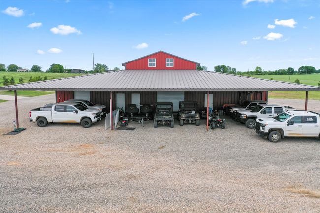 View of car parking with a carport and an outbuilding | Image 29