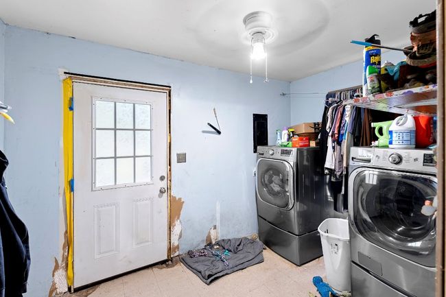 Washroom with independent washer and dryer, ceiling fan, and tile patterned floors | Image 16