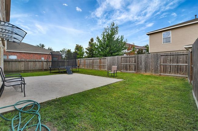 Expansive, private backyard with secure fencing. | Image 42