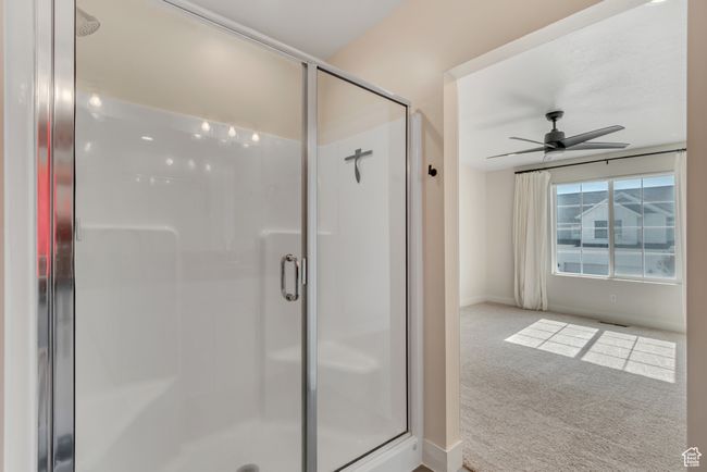 Bathroom featuring ceiling fan and a shower stall | Image 19