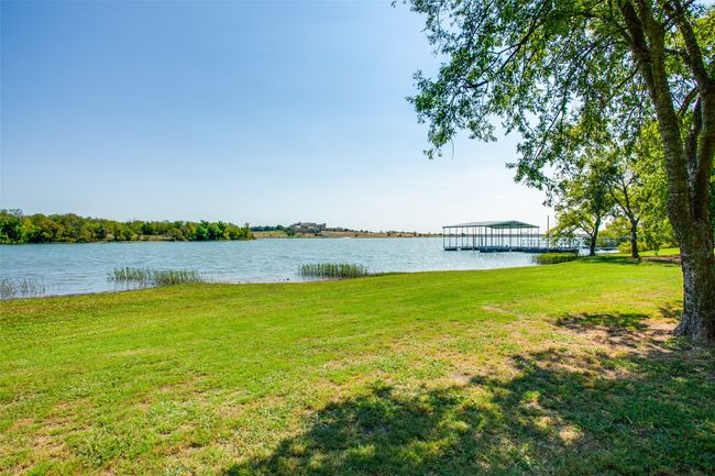 Love fishing? Come out to the boat dock and fish under the shade! Don’t want to fish? Then you can just sit, dangle your feet in the water and take in the breathtaking scenery from the private dock. | Image 34