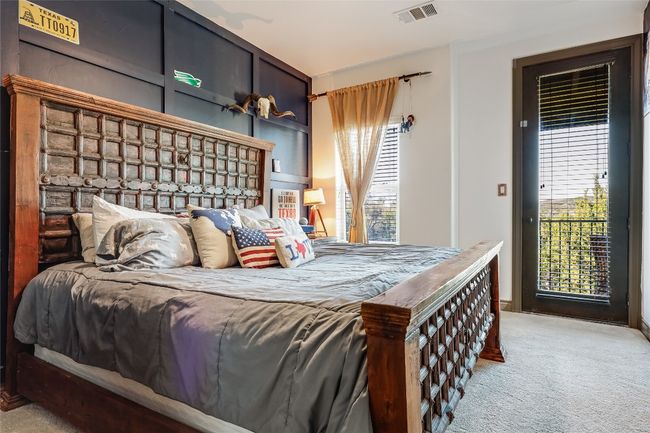 Bedroom featuring visible vents, multiple windows, and carpet | Image 24