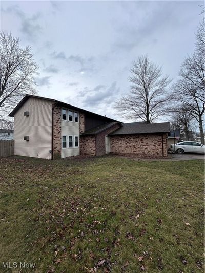 View of side of home with a yard | Image 2