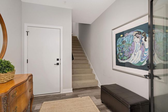 Garage entry and stairway to main level. Extra garage storage would make for an easy "flex room" off entryway landing. | Image 22